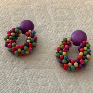 Colorful pierced wooden earrings. Excellent condition and never worn.